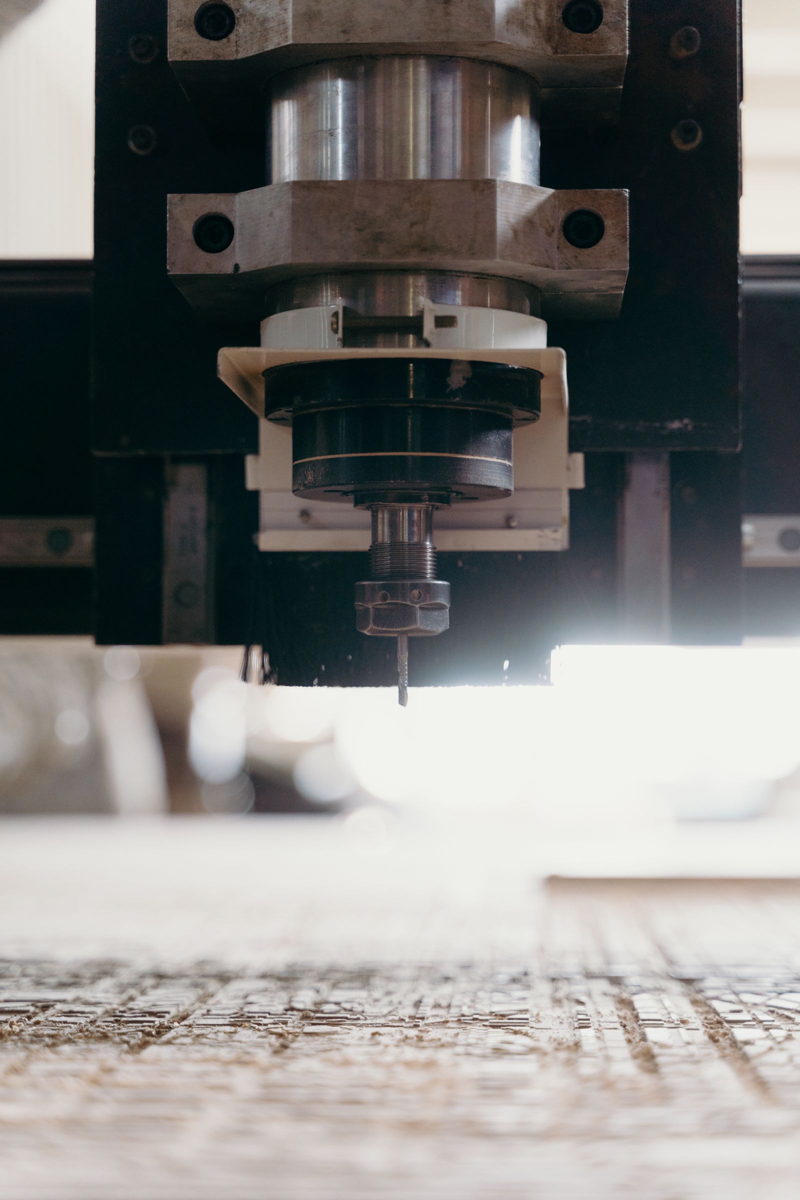 Four-axis CNC milling cell in production