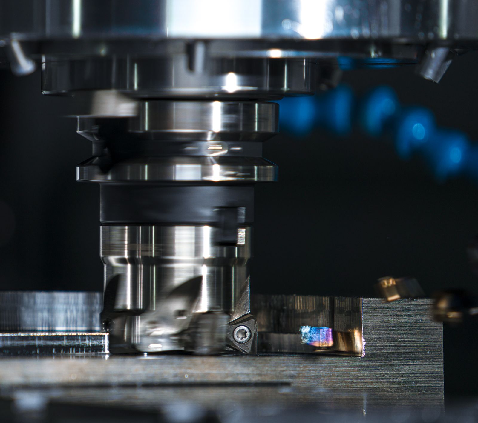 Four-axis CNC milling cell in production