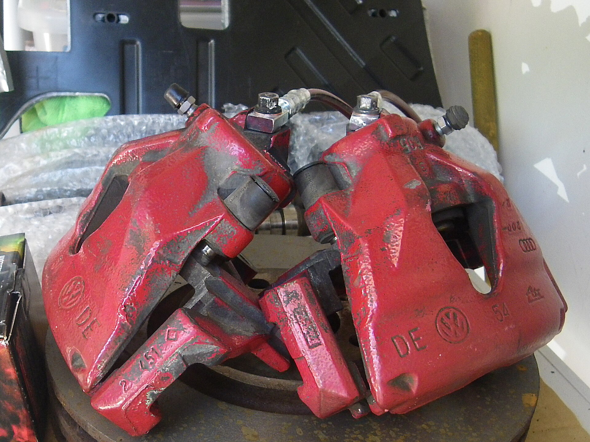 Automotive brake caliper and suspension components